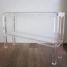 an acrylic console table with clear legs