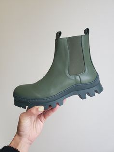 Chunky pull-on Chelsea boot in Forest Green heavy-duty microfiber faux calf. Waterproof. Biodegradable high density rubber sole in Dark green. Info & Care 100% Microfiber Handmade in Portugal Size & Fit Whole sizes only, runs slightly wide Returns & Exchanges New and unused full-price merchandise returned 14 days after receipt is eligible for refund or exchange. Discounted merchandise is final sale. Cowl Top, Fishtail Parka, Zip Front Dress, Cropped Flare Pants, Twist Front Dress, Lace Pants, Single Button Blazer, Aviator Jackets, Belted Trench Coat