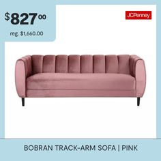 a pink couch sitting on top of a blue floor next to a white wall with the words $ 827 00 reg $ 860 00