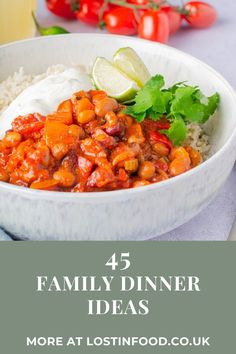 a white bowl filled with beans and rice on top of a table next to a glass of orange juice