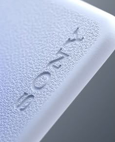 closeup of the word sony on an electronic device's back cover and side panel