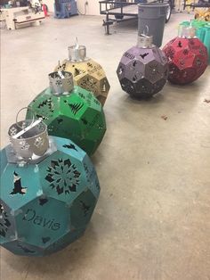 several different colored ornaments sitting on the floor