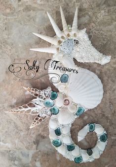 the seahorse is made out of shells and beads