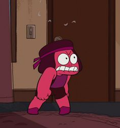 an animated pink cartoon character standing in front of a door with its mouth wide open