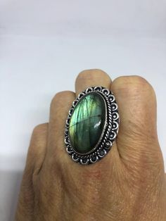 Huge blue green Labradorite rainbow moonstone Lovely vintage silver setting is low content silver Size 9.5 My jeweler can re size it up or down for a $15 fee Ring is long covers from knuckle to knuckle. All rings are shipped in a nice gift box. Check out our over a THOUSAND great reviews Engraving is $4 per letter and is not always perfect depending on the piece. It can take a few days if the jeweler is busy. This is payable to Paypal Judithsltd@gmail.com Vintage Silver Moonstone Ring With Large Stone, Vintage Oval Labradorite Jewelry, Vintage Labradorite Gemstone Rings, Vintage Labradorite Gemstone Jewelry, Handmade Green Labradorite Rings, Vintage Labradorite Ring, Green Labradorite Ring, Green Labradorite, Labradorite Stone