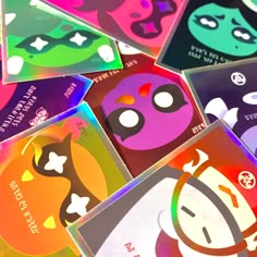 many different colored cards with faces on them