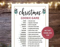 christmas cookie game printable on a wooden table with lights and pine cones in the background