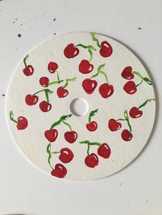 a painting with cherries painted on it