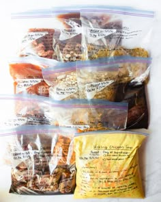 four bags of food sitting next to each other on top of a white countertop