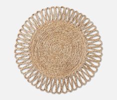 a round placemat made out of jute, with an intricate design on the side