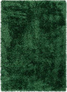 an area rug with green grass on the bottom, and white border in the middle