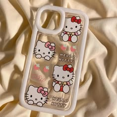 the hello kitty phone case is laying on a white sheet