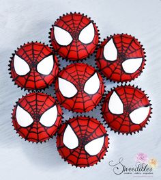 spiderman cupcakes with white frosting on top