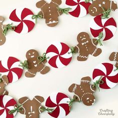 some very cute looking gingerbreads with candy canes on them