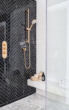 a walk in shower sitting next to a white sink under a faucet mounted on a wall