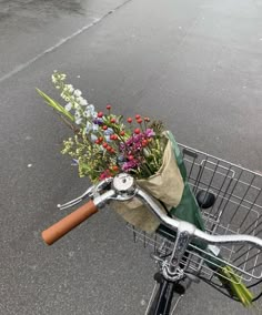 a bicycle with flowers in the front basket