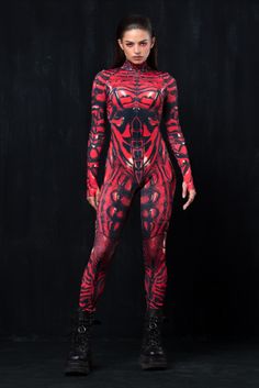 a woman in a red and black body suit