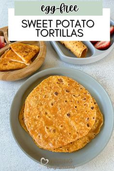 an egg - free sweet potato tortillas on a blue plate with strawberries