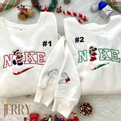 Get into the festive spirit with our Mickey and Minnie Mouse Couple Christmas Disney Nike Embroidered Sweatshirts. Made from high-quality materials, these sweatshirts feature adorable embroidered Mickey and Minnie Mouse designs, perfect for celebrating the holiday season in style. The sweatshirts are designed by Nike, ensuring top-notch quality and comfort. The cozy fabric keeps you warm during the colder months, while the embroidered details add a touch of charm and uniqueness to your outfit. W Christmas Disney Sweaters, Nike Couple Hoodies, Disney Christmas Sweatshirts, Nike Couple, Pull Nike, Disney Christmas Outfits, Nike Embroidered Sweatshirt, Disney Nike, Bingo Christmas