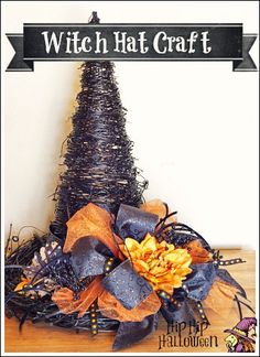 a halloween tree made out of branches and ribbons with the words witch hat craft above it