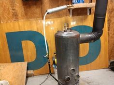 an industrial water heater in the process of being installed to a wood paneled wall