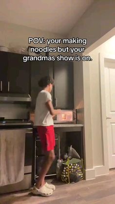 a man standing in front of a stove top oven