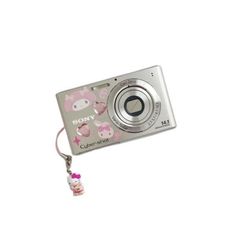 a digital camera with a hello kitty keychain attached to it's side