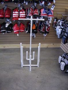 a rack with hockey gear hanging from it