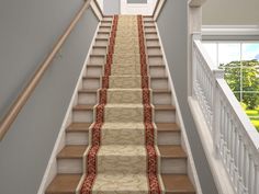 a staircase with carpeted steps leading up to an open door