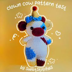 a crocheted stuffed animal with a crown on it's head and the words down cow pattern test written below