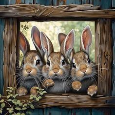 three rabbits sitting in front of a wooden frame