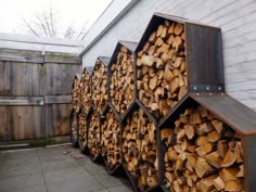 several stacks of firewood stacked on top of each other