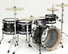 a black and white photo of a drum set