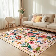 a living room with a floral rug on the floor and a couch in front of it