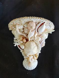 there is a vase with shells on it