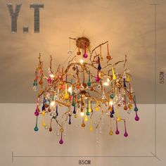 a chandelier hanging from the ceiling in a room with measurements for each light