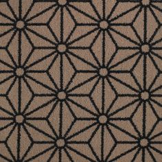 a brown and black rug with an intricate design