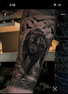 a man with a wolf tattoo on his arm