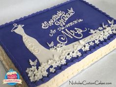 a blue and white birthday cake with a giraffe on it's side