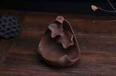 a chocolate egg shell sitting on top of a wooden table