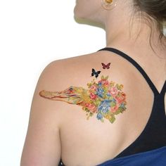 a woman with a tattoo on her back