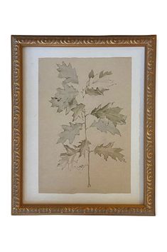 a painting with leaves on it hanging in a wooden frame