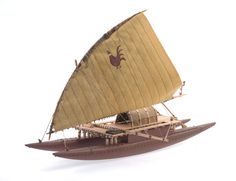 a toy sailboat with an antelope on it's side and sails down