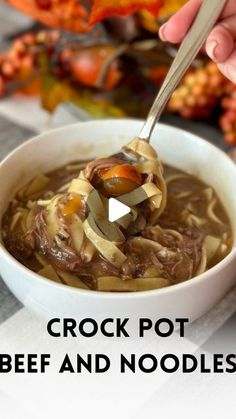 a person holding a spoon over a bowl of beef and noodle soup with the words crock pot beef and noodles