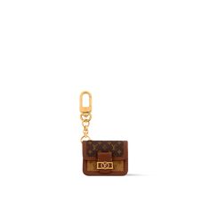 LOUIS VUITTON® - Baby Dauphine Bag Charm - Monogram Luxury Logo Bags As Gifts, Designer Travel Bag With Logo Charm, Designer Brown Monogram Bag, Brown Designer Monogram Bag, Louis Vuitton Gifts, Micro Bags, Louis Vuitton Official Website, Trunk Bag, Girly Bags