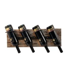 four wine bottles are hanging on a wooden rack