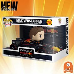 a pop vinyl figure in a box with a red bull racing car on it's side