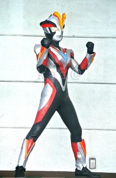 a statue of a person wearing a red, white and blue suit