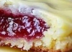 a close up view of a pastry with jam on the top and bottom part of it