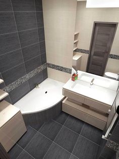 a bathroom with grey tiles and white fixtures on the walls, along with a bathtub